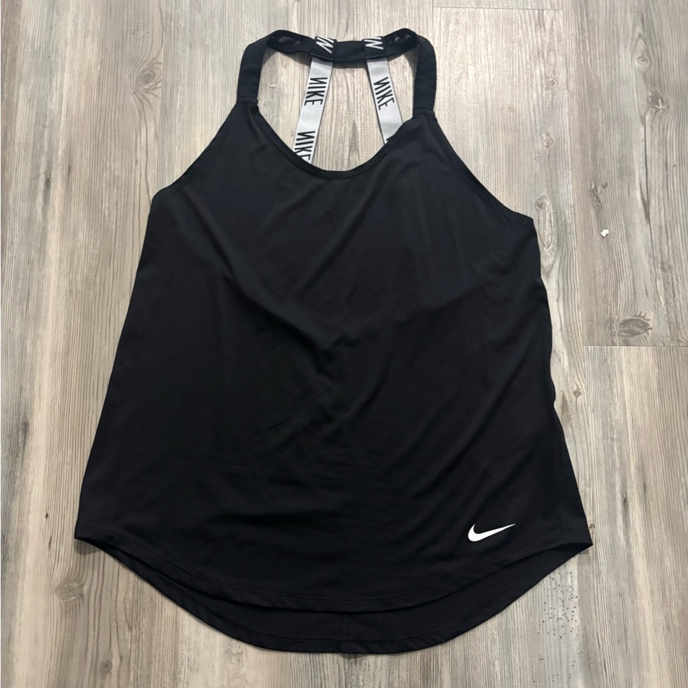 Nike black and white  tank top. Features white Nike logo and straps.
